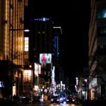 cars on a street in tokyo at night