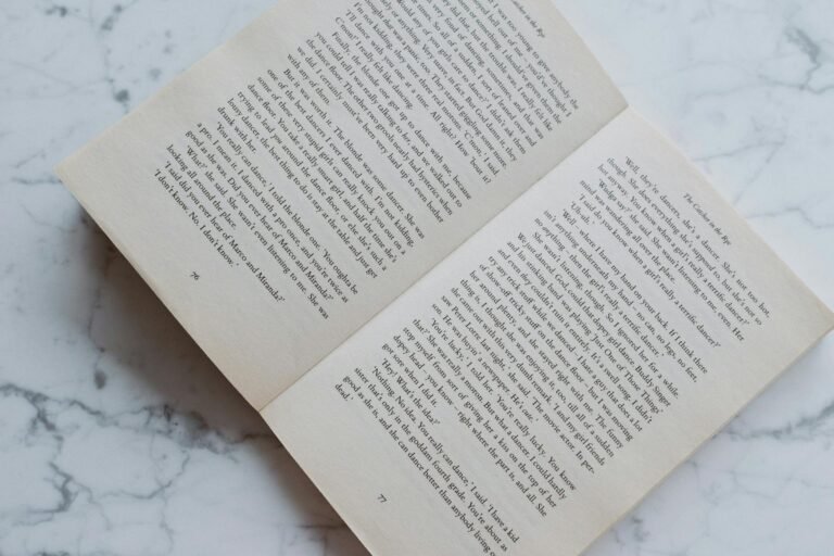 opened book lying on marble desktop