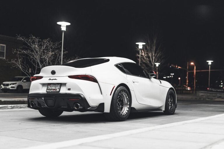photo of parked white toyota supra