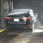 carwashed black sedan